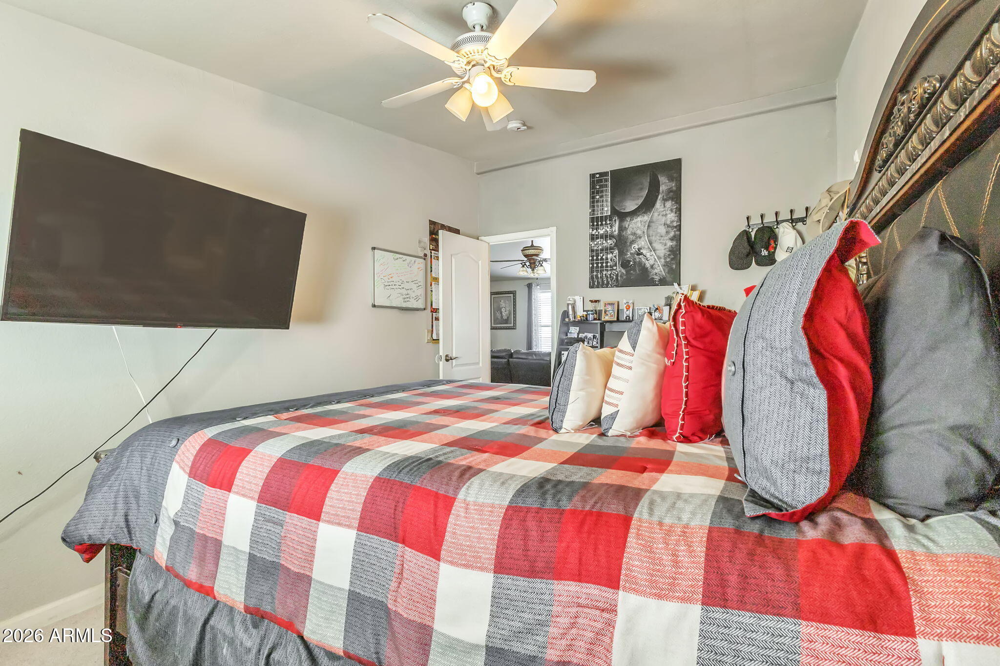1236 West Judd Road San Tan Valley, AZ 85144 - Photo 19 of 28 a bedroom with a bed and a flat screen tv