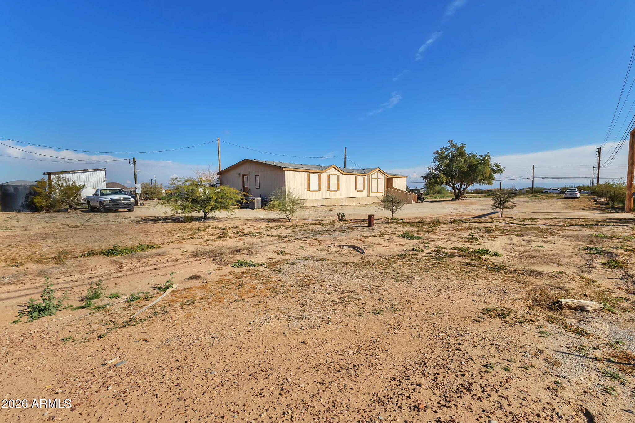 1236 West Judd Road San Tan Valley, AZ 85144 - Photo 3 of 28 a view of a dirt road and building in the background