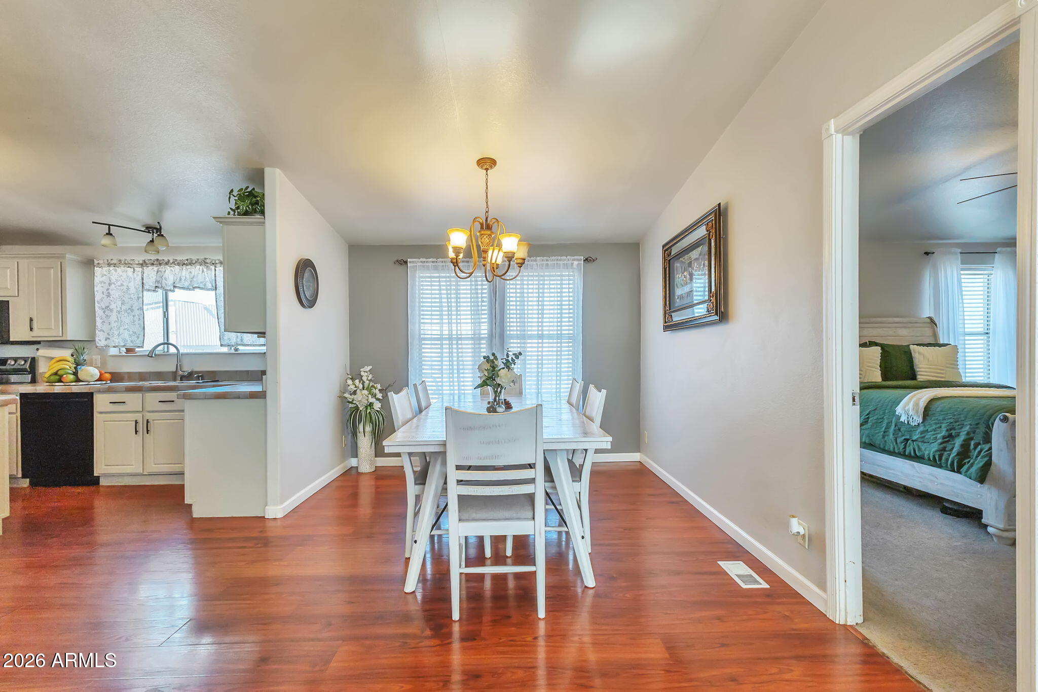 1236 West Judd Road San Tan Valley, AZ 85144 - Photo 8 of 28 a view of a dining room with furniture and wooden floor
