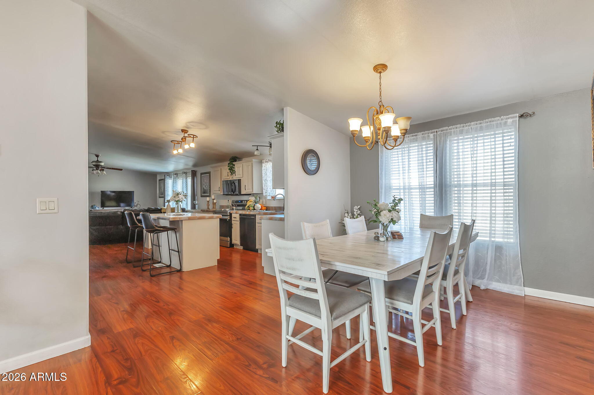 1236 West Judd Road San Tan Valley, AZ 85144 - Photo 9 of 28 a view of a dining room with furniture and wooden floor