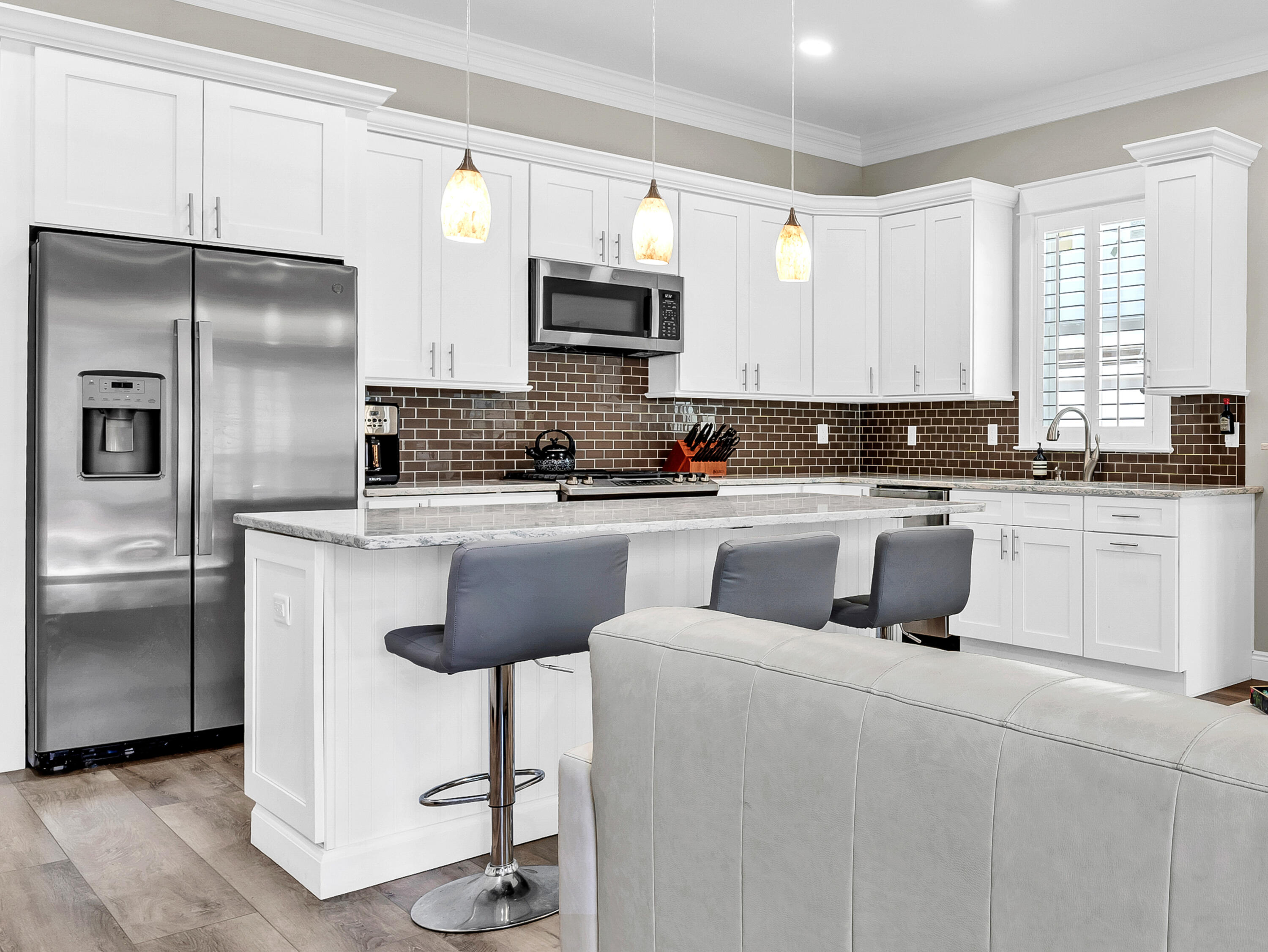 4707 Amhurst Circle Destin, FL 32541 - Photo 11 of 40 a kitchen with a sink stainless steel appliances and cabinets