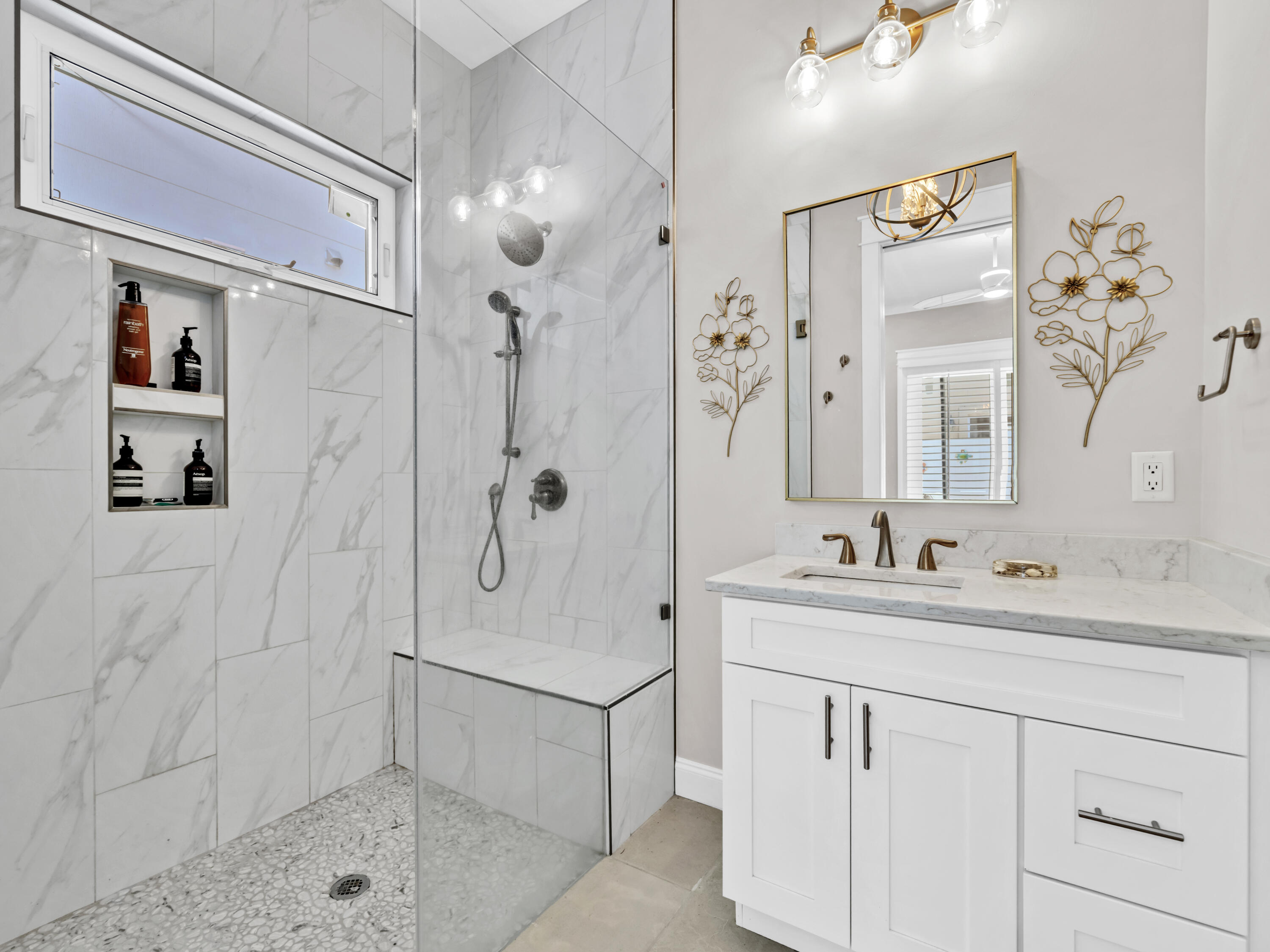 4707 Amhurst Circle Destin, FL 32541 - Photo 4 of 40 a bathroom with a shower sink vanity and mirror