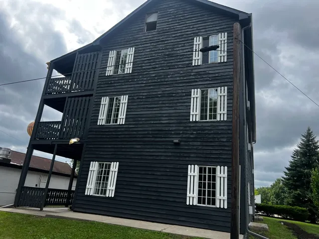 a view of a house with a street