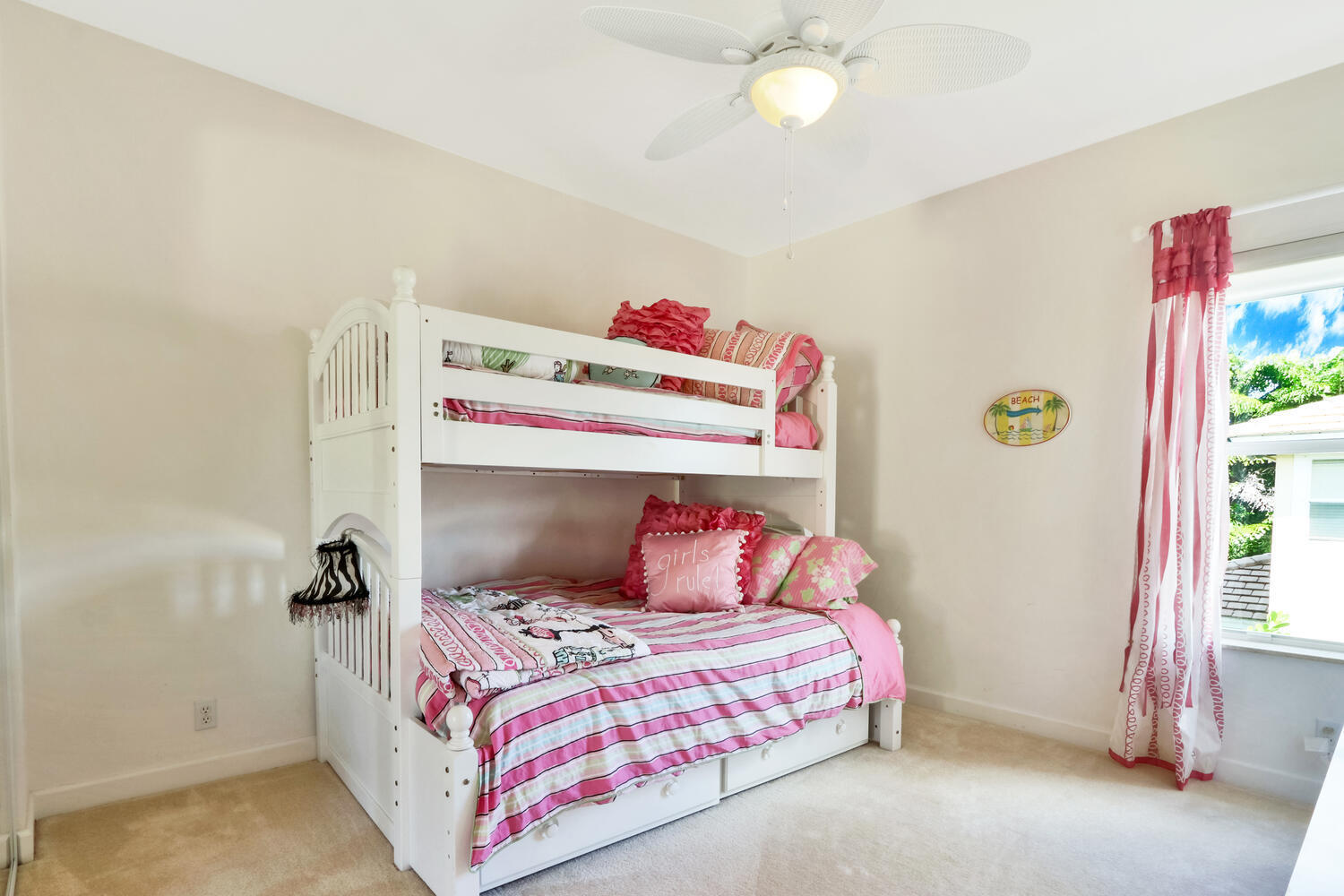 585 Southwest Yacht Basin Way Stuart, FL 34997 - Photo 19 of 31 a bedroom with a bed and a window