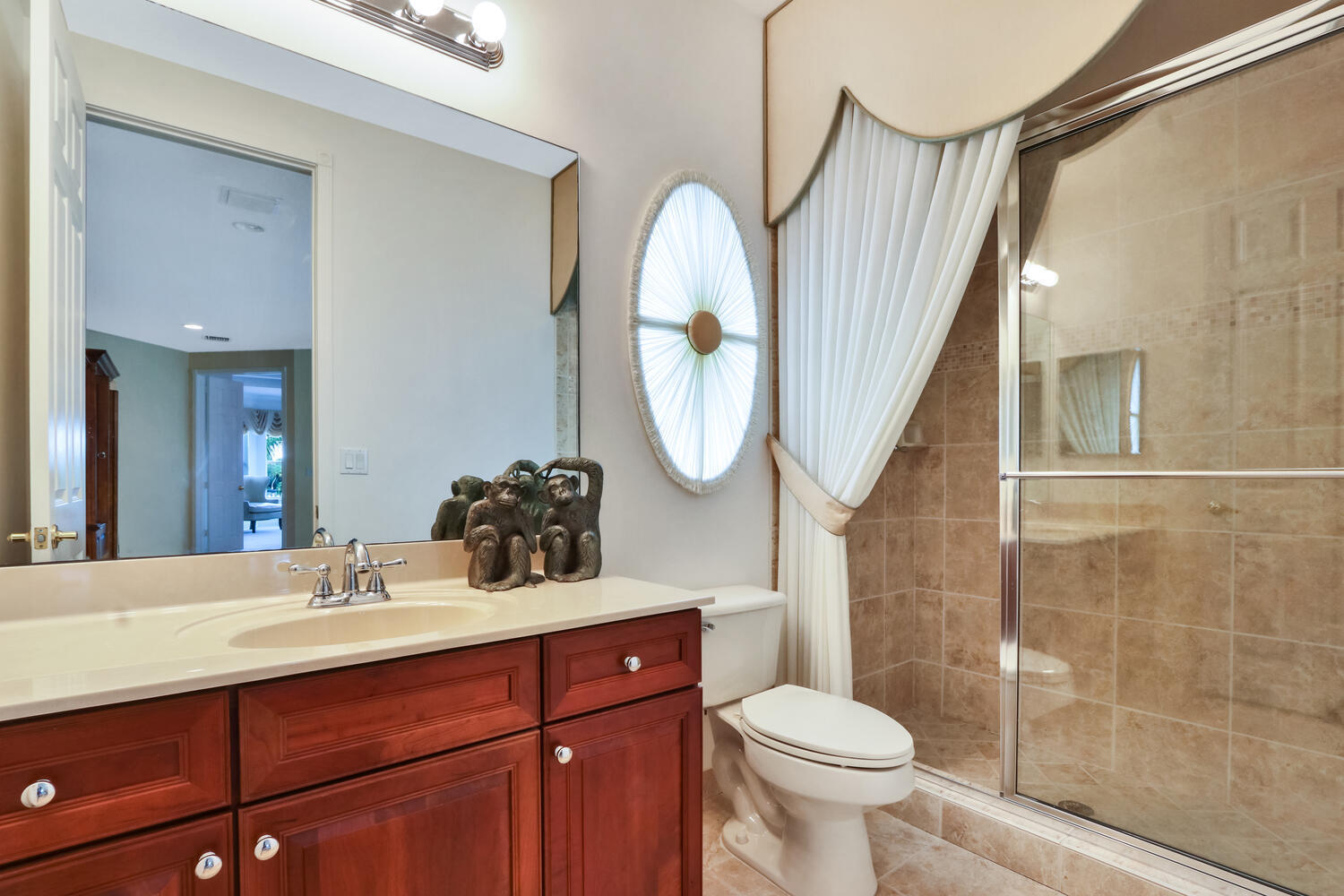 585 Southwest Yacht Basin Way Stuart, FL 34997 - Photo 20 of 31 a bathroom with a toilet sink and mirror