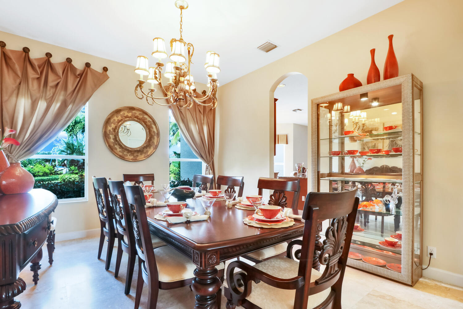 585 Southwest Yacht Basin Way Stuart, FL 34997 - Photo 25 of 31 a view of a dining room with furniture a chandelier and a window