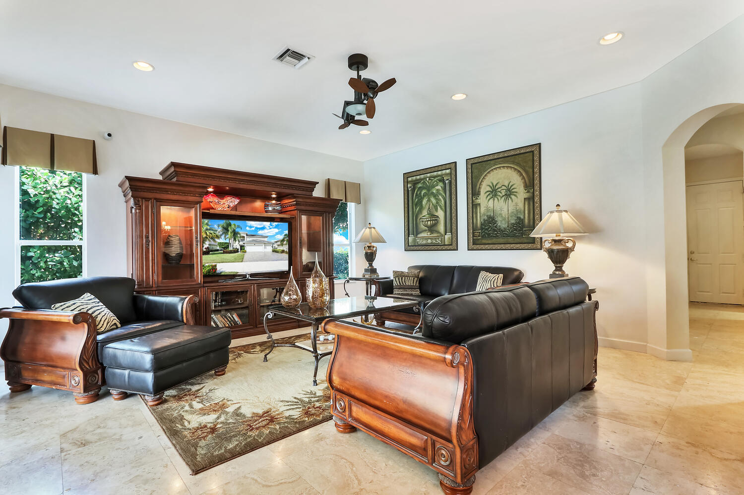 585 Southwest Yacht Basin Way Stuart, FL 34997 - Photo 27 of 31 a living room with furniture and a flat screen tv