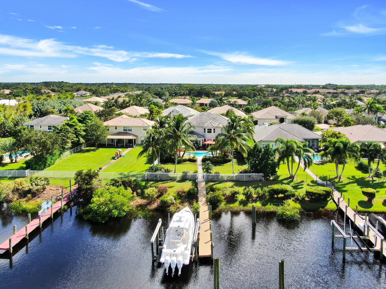 585 Southwest Yacht Basin Way Stuart, FL 34997 - Photo 4 of 31 an aerial view of a house with yard swimming pool and lake view