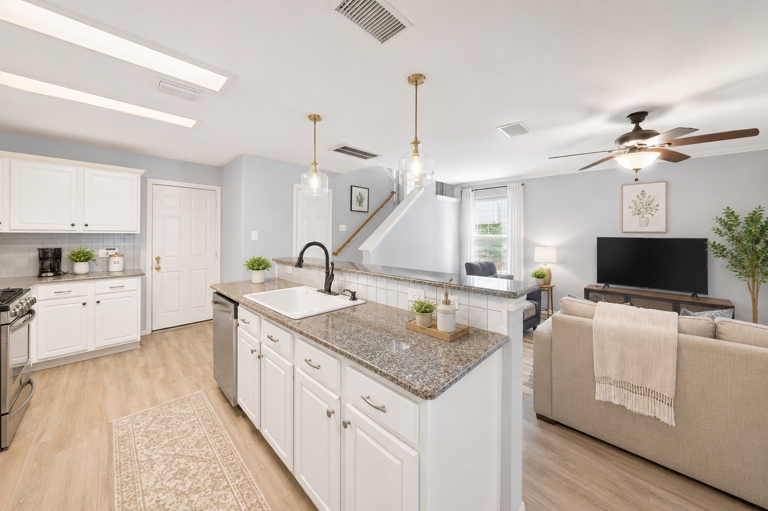 38 Musgrove Place Spring, TX 77382 - Photo 10 of 36 Bright open-concept kitchen with granite island, pendant lighting, and seamless flow to the living area.