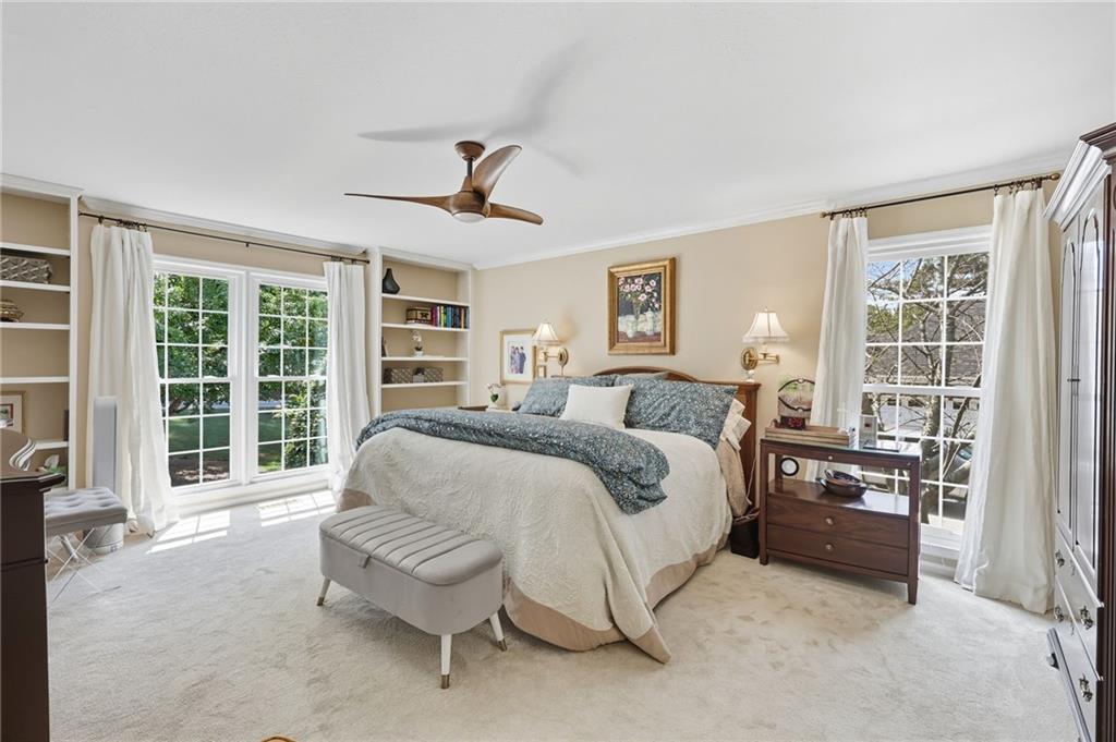 153 Dunlap Landing Road Gainesville, GA 30506 - Photo 27 of 67 a spacious bedroom with a bed and glass door