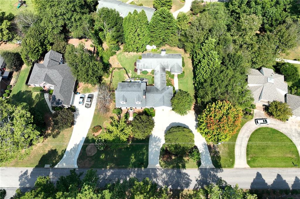 153 Dunlap Landing Road Gainesville, GA 30506 - Photo 40 of 67 an aerial view of a house with a yard and large trees