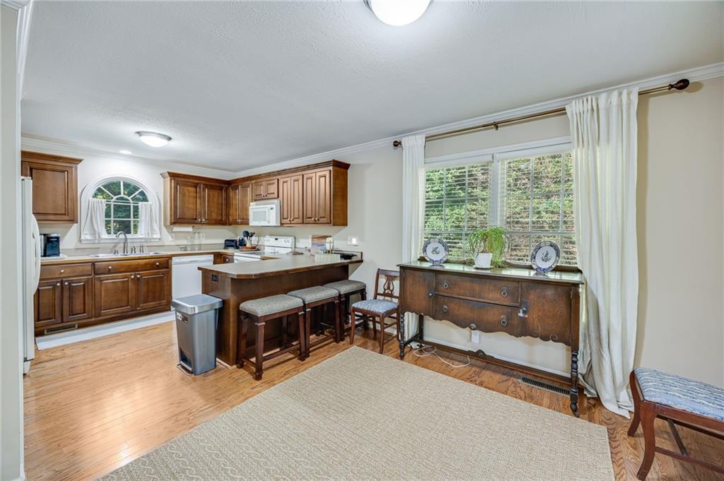 153 Dunlap Landing Road Gainesville, GA 30506 - Photo 50 of 67 a kitchen with a sink stove and refrigerator