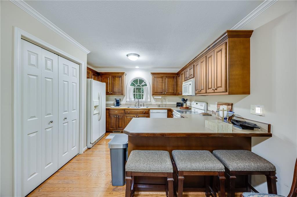 153 Dunlap Landing Road Gainesville, GA 30506 - Photo 51 of 67 a view of a dining room with furniture and wooden floor