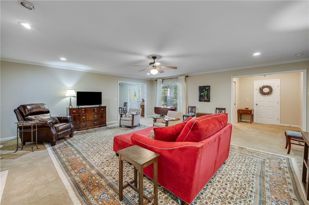 153 Dunlap Landing Road Gainesville, GA 30506 - Photo 57 of 67 a living room with furniture and a flat screen tv