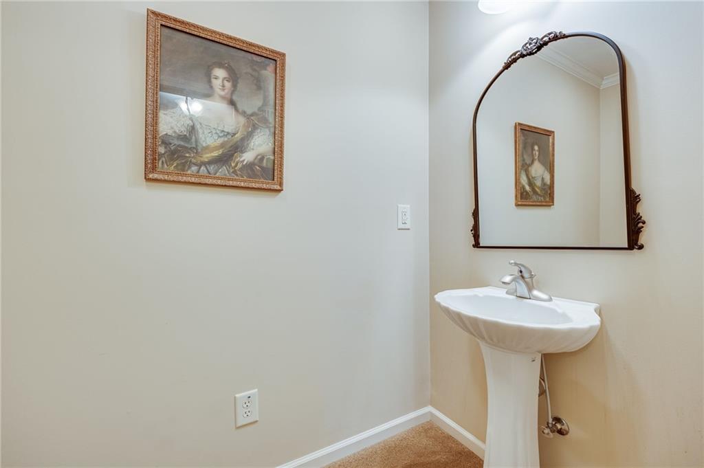 153 Dunlap Landing Road Gainesville, GA 30506 - Photo 59 of 67 a bathroom with a sink and a mirror