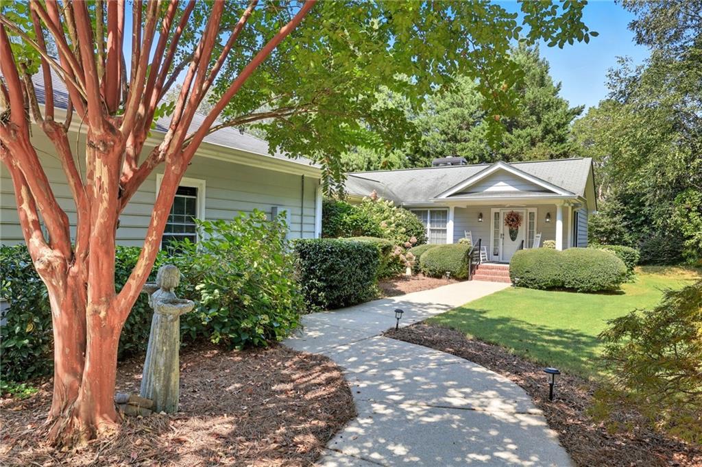 153 Dunlap Landing Road Gainesville, GA 30506 - Photo 6 of 67 a front view of a house with a yard
