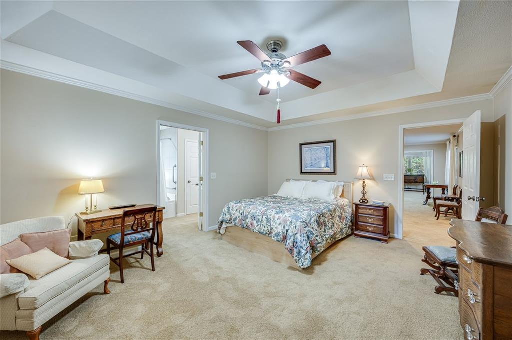 153 Dunlap Landing Road Gainesville, GA 30506 - Photo 62 of 67 a bedroom with furniture and a chandelier