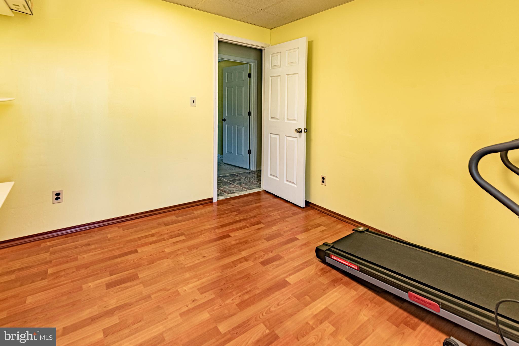 9619 Boyds Turn Road Owings, MD 20736 - Photo 32 of 69 a view of a room with wooden floor