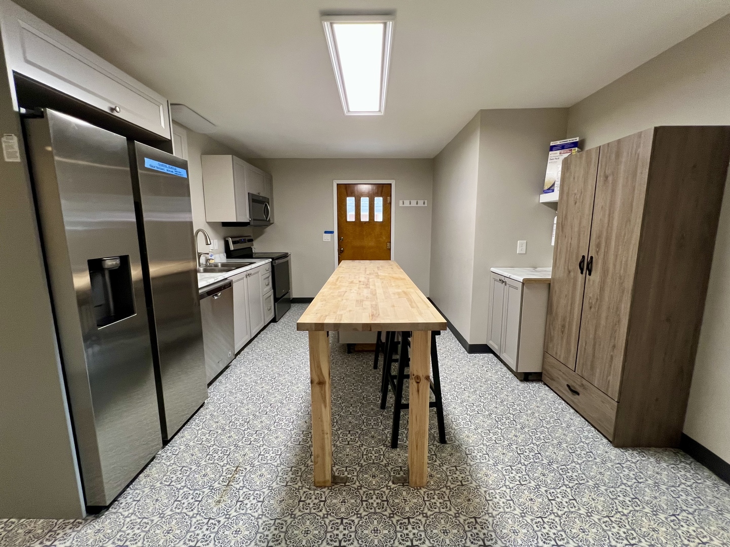 1528 Division Street Charleston, IL 61920 - Photo 11 of 45 a kitchen with stainless steel appliances granite countertop a refrigerator and a stove top oven