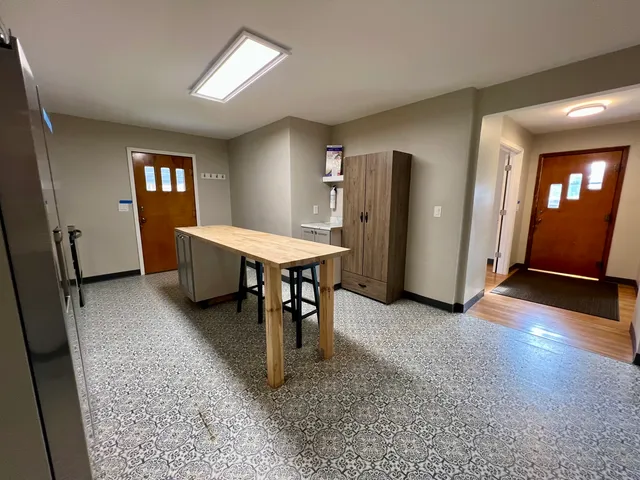 an open dining room with furniture and window