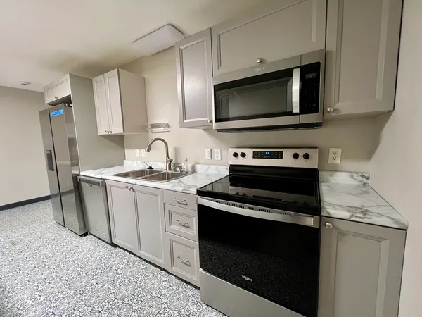 a kitchen with a stove and a microwave