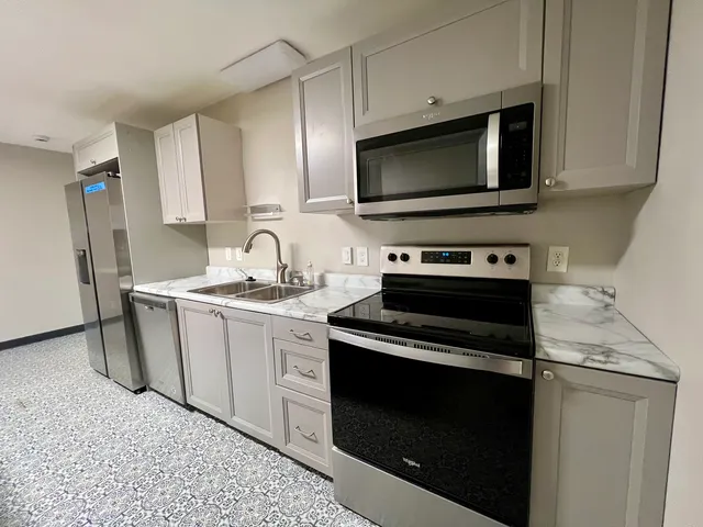 a kitchen with a stove and a microwave