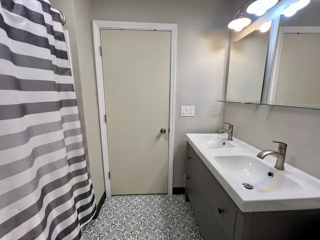 a bathroom with a sink and a mirror
