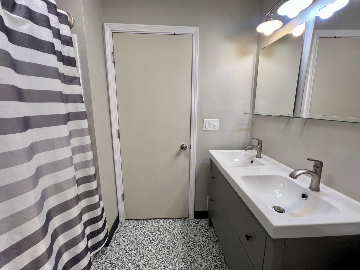1528 Division Street Charleston, IL 61920 - Photo 18 of 45 a bathroom with a sink and a mirror