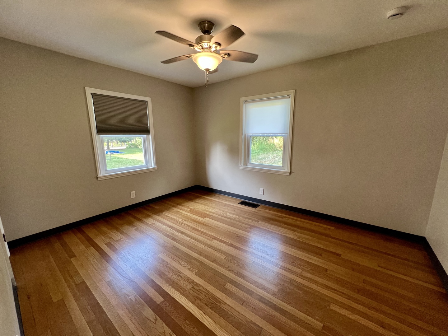 1528 Division Street Charleston, IL 61920 - Photo 23 of 45 a view of an empty room with a window and wooden floor