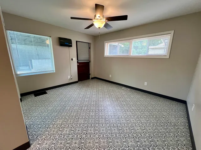 a view of an empty room with a window