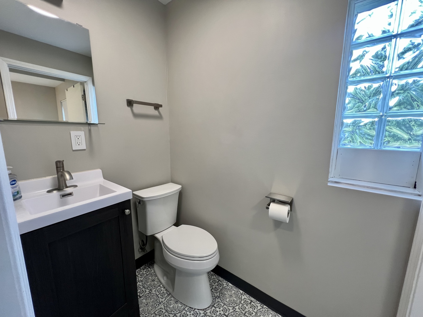 1528 Division Street Charleston, IL 61920 - Photo 34 of 45 a bathroom with a toilet a sink and a window