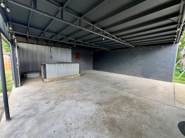 a view of a house with a yard and sitting area