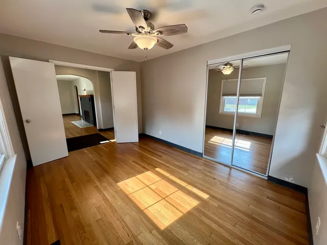 a bedroom with a bed and a view of bathroom