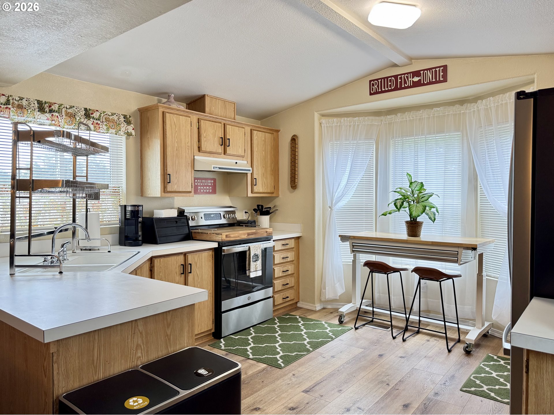 3760 Highway 101, Unit 1 Florence, OR 97439 - Photo 18 of 32 a kitchen with a sink appliances and cabinets