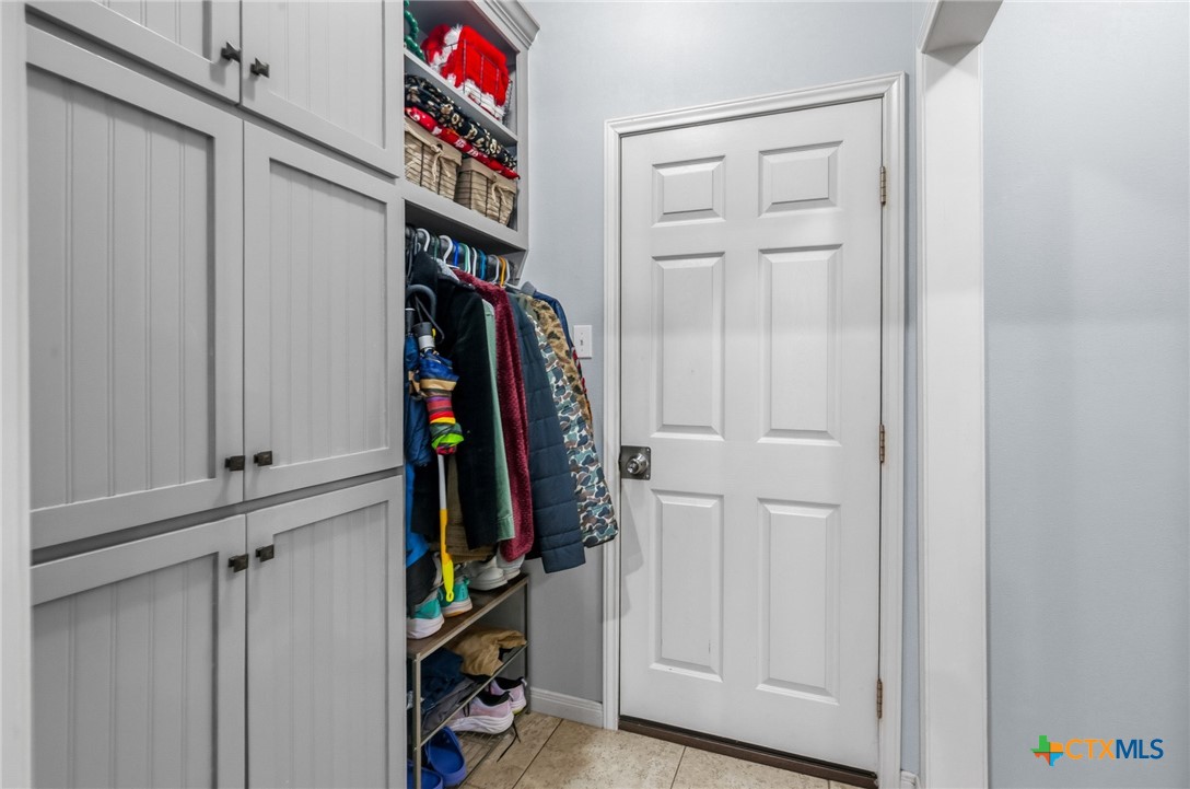 711 Mason Circle Victoria, TX 77904 - Photo 20 of 29 a view of walk in closet with clothes