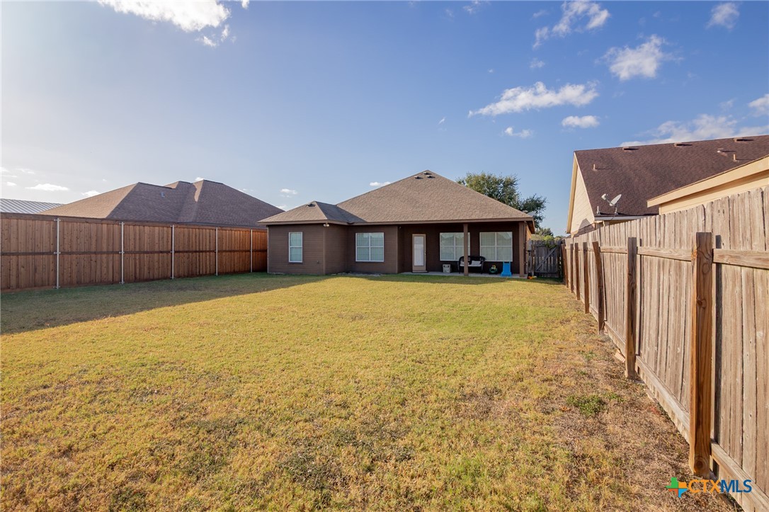 711 Mason Circle Victoria, TX 77904 - Photo 22 of 29 a front view of a house with a yard