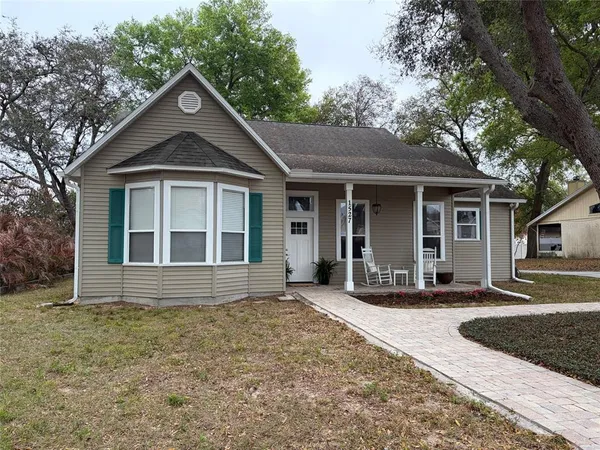 front view of a house with a yard