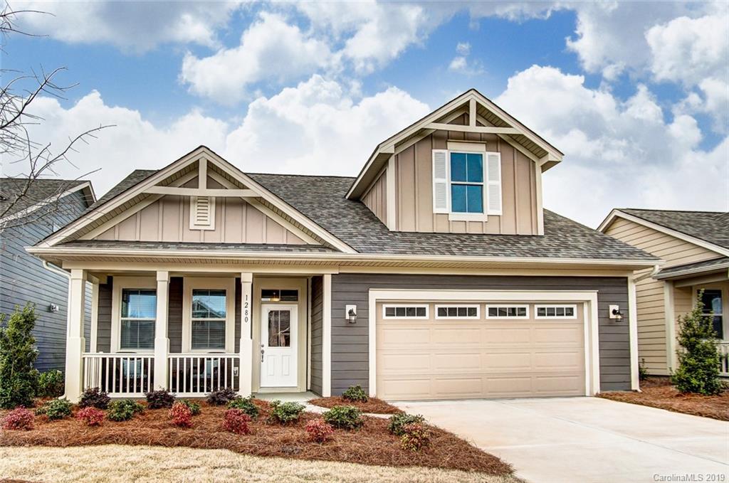 1280 Independence Street, Unit 58 Tega Cay, SC 29708 - Photo 1 of 31 a front view of a house with a garden