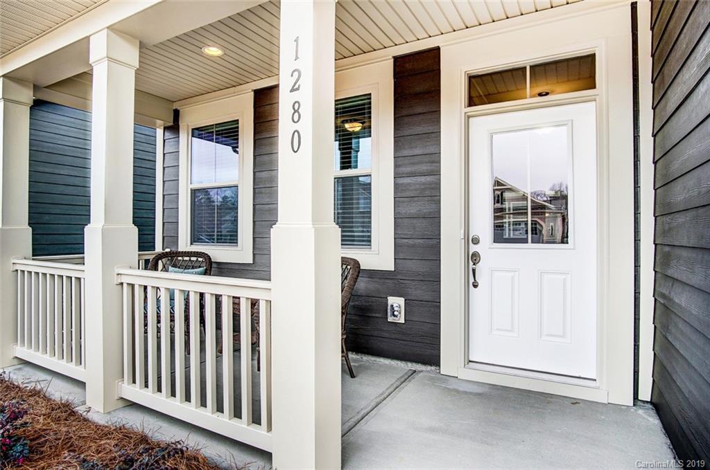 1280 Independence Street, Unit 58 Tega Cay, SC 29708 - Photo 2 of 31 a view of a house with a porch
