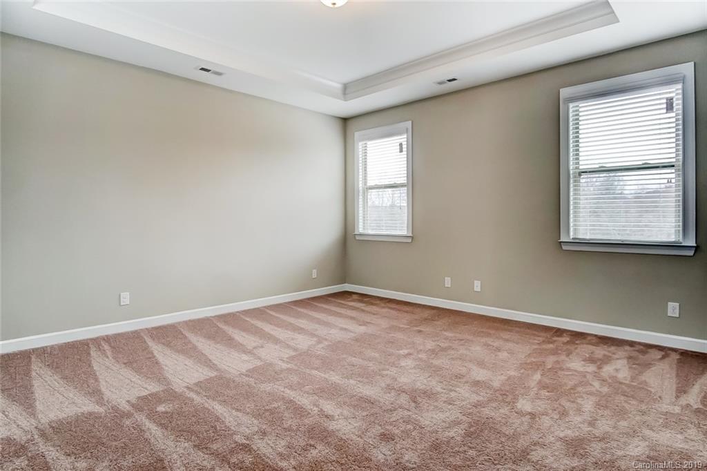 1280 Independence Street, Unit 58 Tega Cay, SC 29708 - Photo 15 of 31 a view of an empty room with a window