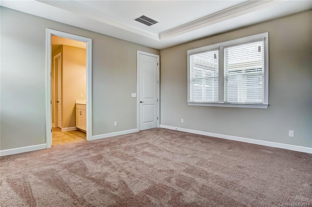 1280 Independence Street, Unit 58 Tega Cay, SC 29708 - Photo 16 of 31 an empty room with windows and closet