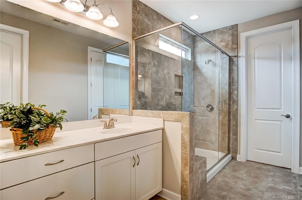 1280 Independence Street, Unit 58 Tega Cay, SC 29708 - Photo 17 of 31 a bathroom with a sink and a mirror