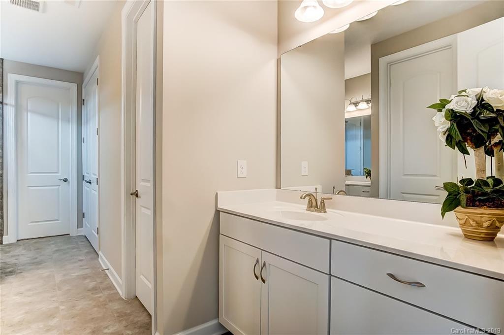 1280 Independence Street, Unit 58 Tega Cay, SC 29708 - Photo 18 of 31 a bathroom with a sink and a mirror