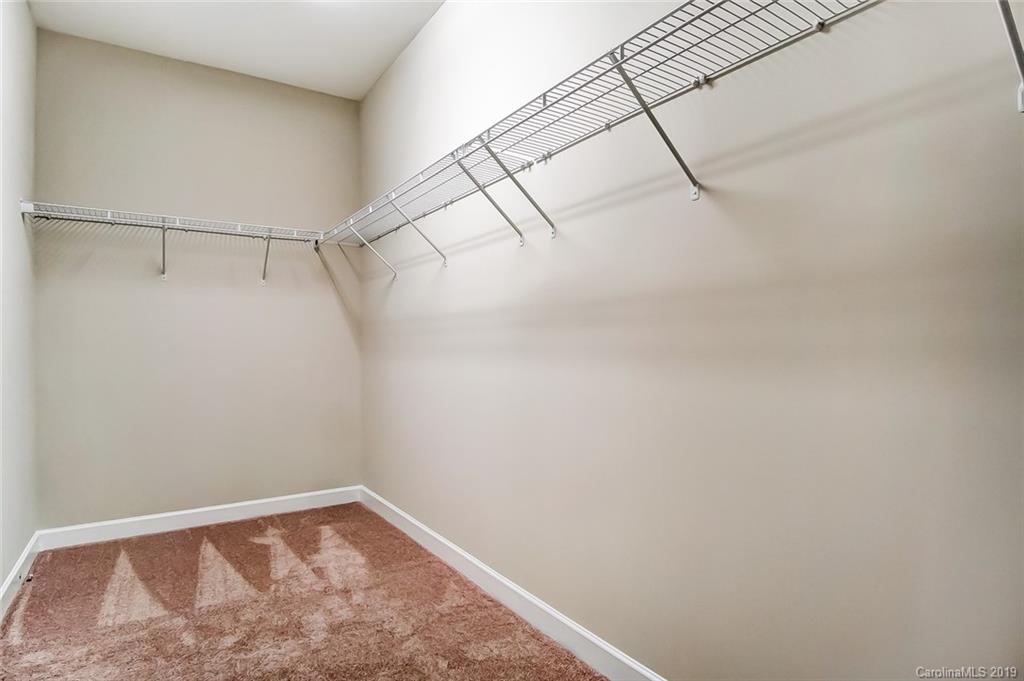1280 Independence Street, Unit 58 Tega Cay, SC 29708 - Photo 20 of 31 a view of a room with racks on the wall