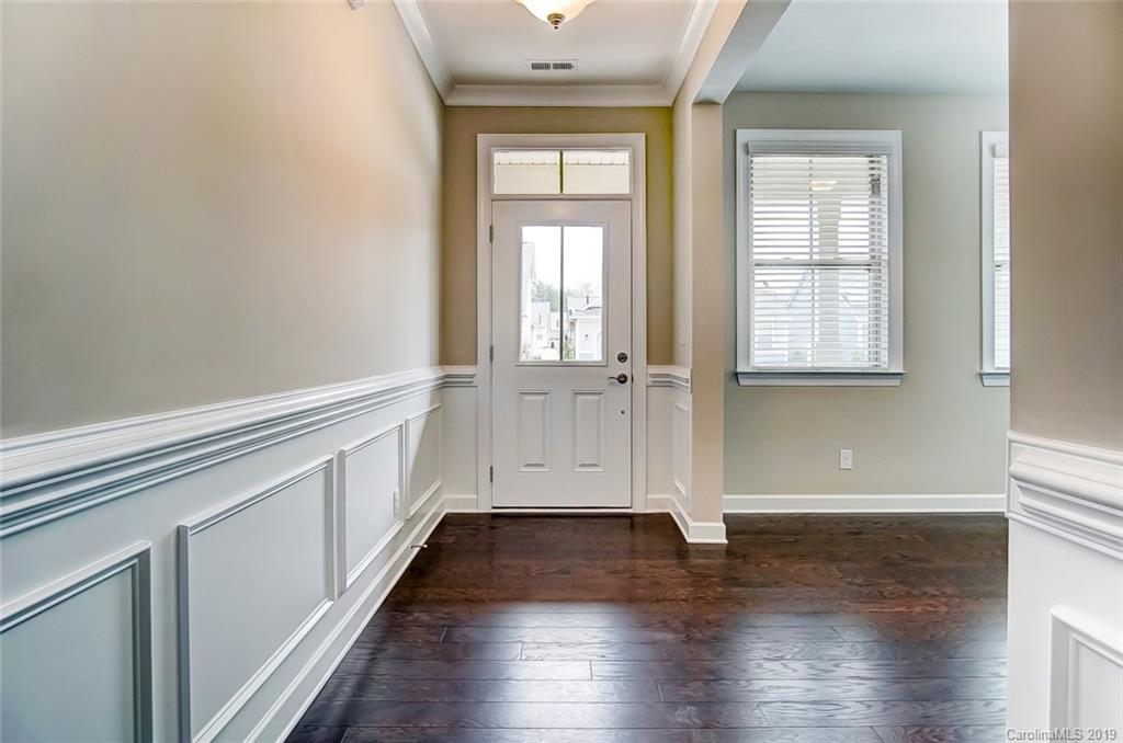 1280 Independence Street, Unit 58 Tega Cay, SC 29708 - Photo 3 of 31 a view of empty room with wooden floor and fan