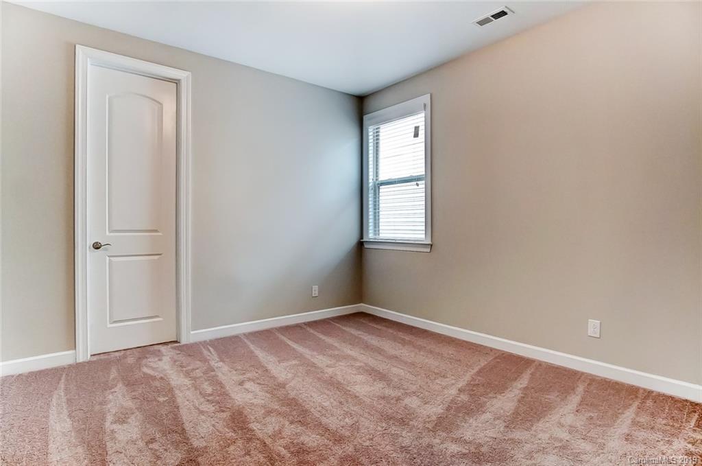 1280 Independence Street, Unit 58 Tega Cay, SC 29708 - Photo 21 of 31 an empty room with windows