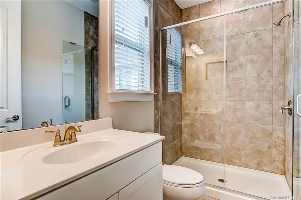 1280 Independence Street, Unit 58 Tega Cay, SC 29708 - Photo 22 of 31 a bathroom with a sink toilet and shower