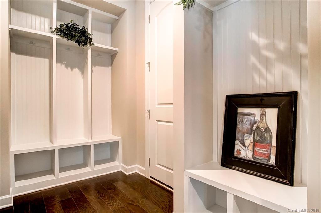 1280 Independence Street, Unit 58 Tega Cay, SC 29708 - Photo 25 of 31 a view of an empty room with wooden floor and a window