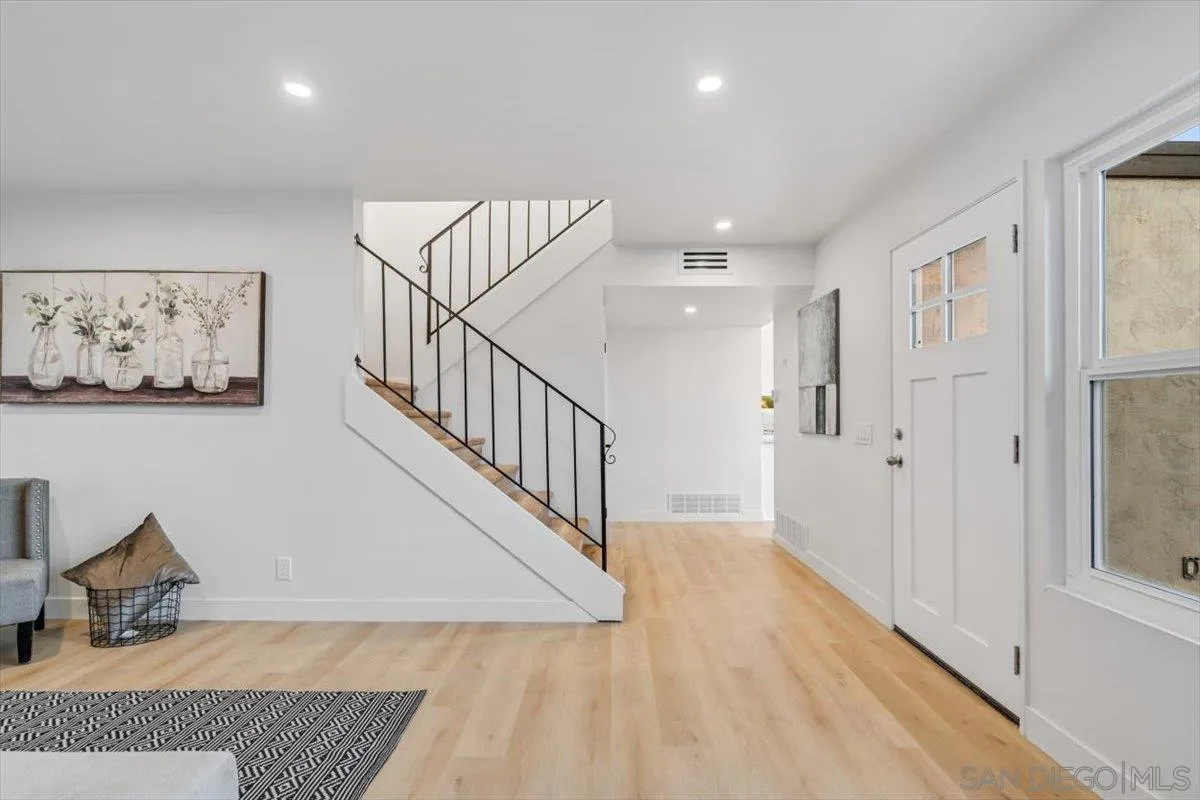 13259 Saddle Ridge Road Lakeside, CA 92040 - Photo 12 of 57 a view of a hallway with wooden floor and staircase