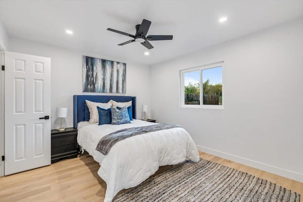 13259 Saddle Ridge Road Lakeside, CA 92040 - Photo 24 of 57 a large bed sitting in a bedroom next to a window